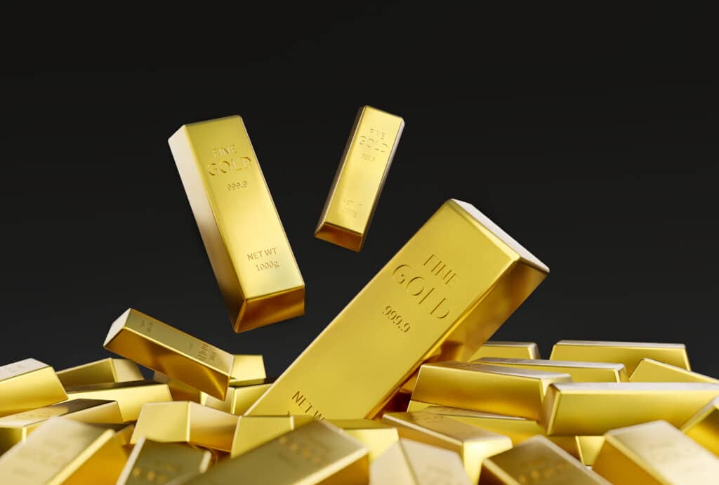 Gold stacked on a black background. XAU