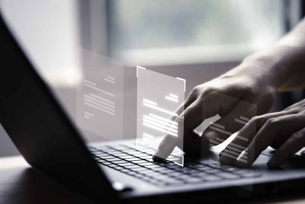 Hand using laptop computer with virtual screen and document for เลือกโบรกเกอร์ Forex