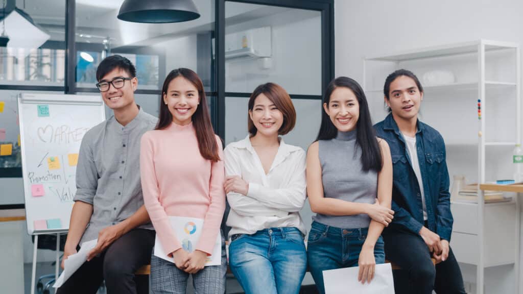 Group of Asia young creative people in smart casual wear looking Gen Y คือใคร Gen Y อายุเท่าไหร่